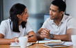 © Nina L/peopleimages.com - It was magnificent, they way we looked like giants. Shot of two businesspeople sitting at a desk in a modern office.