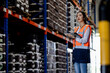 © Shutter B - Professional beautiful asian woman worker checks stock and inventory with digital tablet computer in the retail warehouse full of shelves with goods. Working in logistics, Distribution center.
