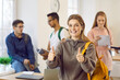 © Studio Romantic - Portrait of smiling teen schoolgirl show thumb up give recommendation to school or college. Happy female student with backpack recommend good courses or training. Education concept.