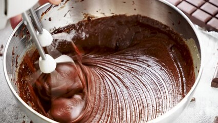 Poster - cooking chocolate cake with raw chocolate dough and whisk