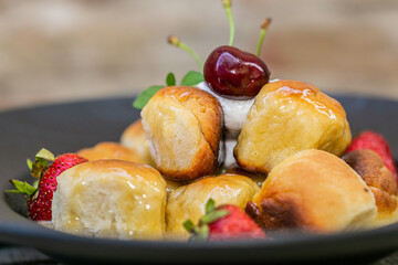 The homemade buns. Homemade delish dessert, vanilla sauce, fresh fruit. Close up