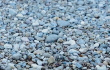 Close-up Of Ground Full Of Stones With Out-of-focus Background