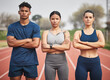 © Siphosethu F/peopleimages.com - Youre witnessing the winning team. Cropped portrait of three young athletes standing outside with their arms folded.