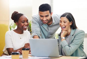 This is what youre looking for. Cropped shot of a handsome young businessman helping two female colleagues with their laptop while working in the office.