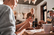 © Yakobchuk Olena - Elderly people making products from clay and listening their teacher at the creative space