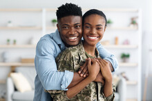 Closeup Portrait Of Cheerful Black Female Soldier Hugging With Husband
