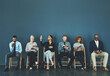 © Tamani Chithambo/peopleimages.com - Choose a network that wont let you down. Shot of a group of business people using their smart devices while waiting to be interview.