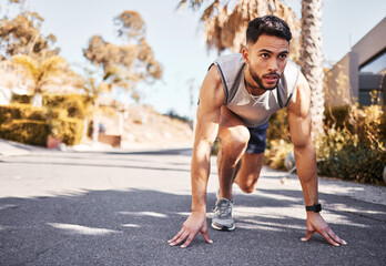 Canvas Print - Im already ready to win marathons. Full length shot of a handsome young man crouched in a set position before running outside.