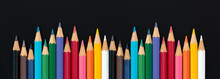 Color Pencils Set, Row Wooden Color Pencils Colored Pencils For Drawing On Matte Black Background. Copy Space