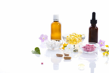 Wall Mural - Various vitamin capsules and dietary supplements isolated on white background with copy space. Vitamin complexes concept.