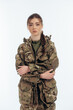 © mishadp - Girl in military uniform. Ukrainian. War in Ukraine. Bucha. on a white background