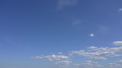 Wall Mural - beautiful early morning sunny sunrise blue sky with fluffy white clouds flying overhead in clear blu