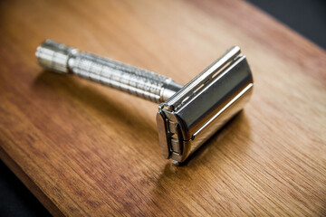 Old vintage shaver on a wooden background