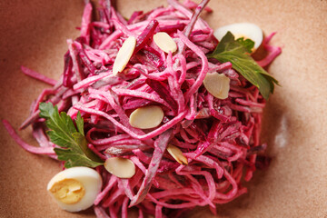 Wall Mural - Daikon and beet salad dressed with mayonnaise or yogurt, garnished with almonds and quail eggs