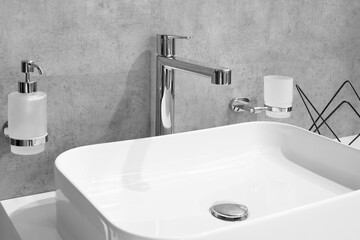 Bathroom interior with sink and faucet.