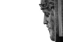 Profile Of Jesus Christ In A Crown Of Thorns Against White Background. Fragment Of An Ancient Statue.