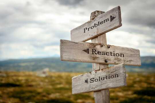 Wall Mural - problem reaction solution text quote written in wooden signpost outdoors in nature. Moody theme feeling.