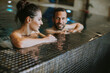 © BGStock72 - Young couple relaxing in a swimming pool