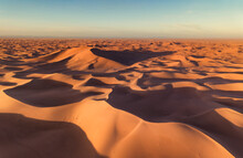 Aerial View On Big Sand Dunes, Landscape In Sahara Desert At Sunrise