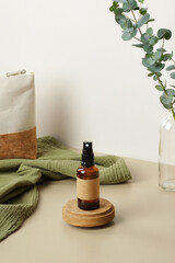 Wall Mural - amber glass spray bottle on wooden platform. natural organic spa cosmetic product packaging design, 