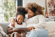 © Kay Abrahams/peopleimages.com - Teach your children well. Shot of a young mother using a digital tablet with her daughter at home.