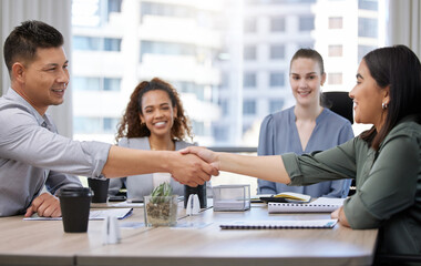 Canvas Print - Its great to have you on the team. Shot of two businesspeople shaking hands in a meeting at work.