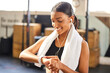 © Anela Ramba/peopleimages.com - She puts the pro in progress. Shot of a fit young woman looking at her watch while working out at a gym.