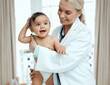 © Kay A/peopleimages.com - When baby is healthy, baby is happy. Shot of a paediatrician examining a baby in a clinic.