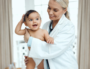 Poster - When baby is healthy, baby is happy. Shot of a paediatrician examining a baby in a clinic.