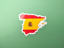 Spain Flag Stickers On A Green Background.