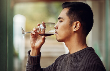 Wall Mural - Now this is a good wine. Shot of a young man out wine tasting.