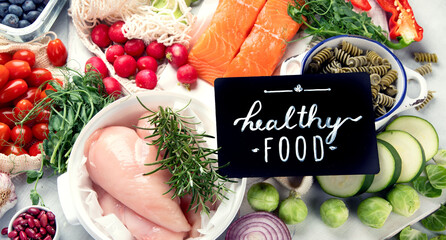 Wall Mural - Healthy food assortment on light background.