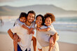 © Alexis Scholtz/peopleimages.com - A man should never neglect his family. Shot of a beautiful young family of three spending the day together at the beach.