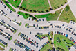 © Mr Twister - urban public parking lot viewed from above in sunny summer day. aerial overhead view.