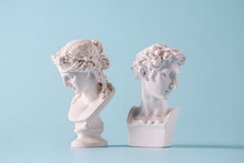 Small Antique Style Roman Busts Facing Away From Each Other