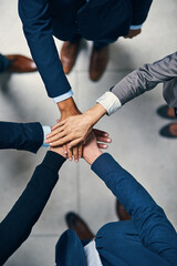 Aufkleber - Together is always better. High angle shot of a group of businesspeople joining their hands together in unity.