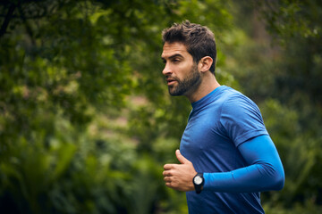 Canvas Print - Go until youve reached your goal. Shot of a sporty middle-aged man out running.