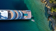 Aerial Drone Top Down Photo Of Luxury Exotic Yacht Nose With Wooden Deck Anchored In Paradise Turquoise Bay