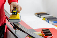 Preparation Of Cross-country Skis In The Ski Service. Application Of Ski Lubricant - Parffin On The Sliding Surface With A Special Iron For Lubrication.