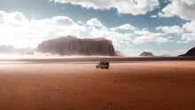 Tourist Jeep Tour In Wadi Rum Desert In Jordan, Natural Landscape Surrounded By Dry And Rocky Mountains, Beautiful Attraction In The Middle East For Adventure Tourism