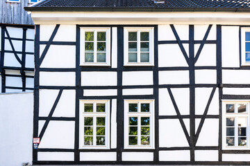 old half-timbered house facade with windows 