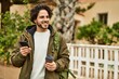 © Krakenimages.com - Handsome hispanic man using smartphone at the city
