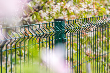 Wall Mural - Steel grating fence made with wire in spring 