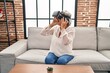 © Krakenimages.com - Middle age woman playing video game using virtual reality glasses at home