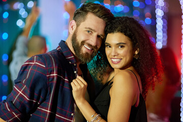 Wall Mural - Enjoying a couples night out at the club. Portrait of an affectionate young couple enjoying the evening in a nightclub.