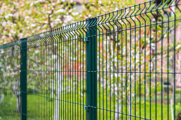 Wall Mural - Steel grating fence made with wire in spring 