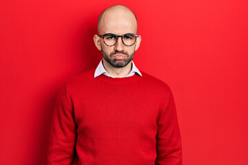 Poster - Young bald man wearing casual clothes and glasses depressed and worry for distress, crying angry and afraid. sad expression.