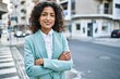 © Krakenimages.com - Young hispanic business woman wearing professional look smiling confident at the city