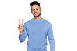 © Krakenimages.com - Young arab man wearing casual clothes smiling with happy face winking at the camera doing victory sign. number two.