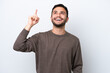 © luismolinero - Young Brazilian man isolated on white background pointing up and surprised